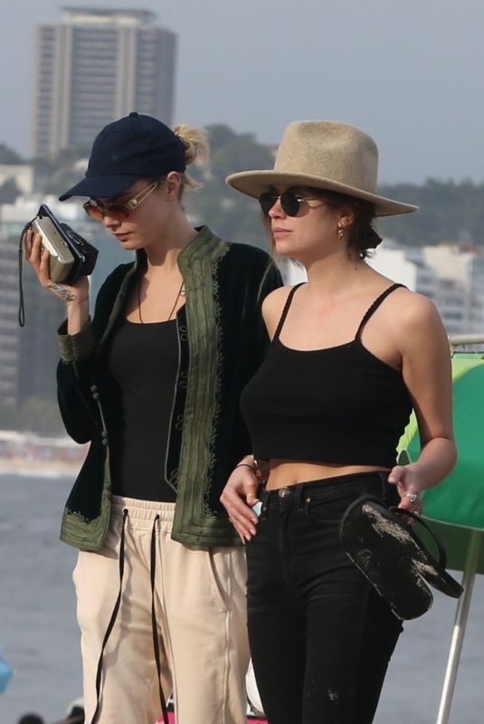 ASHLEY BENSON and CARA DELEVINGNE Out on Copacabana Beach in Rio De Janeiro 01/04/2020