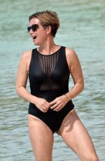EMMA FORBES in a Black Swimsuit at a Beach in Barbados 01/01/2020