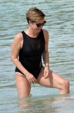 EMMA FORBES in a Black Swimsuit at a Beach in Barbados 01/01/2020