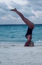 ILARY BLASI in Swismuit Doing Yoga at a Beach in Maldives 01/07/2020