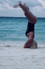 ILARY BLASI in Swismuit Doing Yoga at a Beach in Maldives 01/07/2020