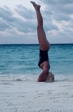ILARY BLASI in Swismuit Doing Yoga at a Beach in Maldives 01/07/2020