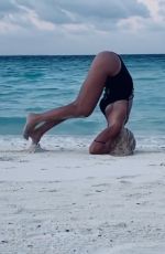 ILARY BLASI in Swismuit Doing Yoga at a Beach in Maldives 01/07/2020