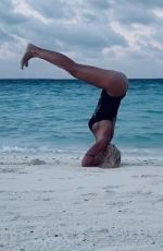 ILARY BLASI in Swismuit Doing Yoga at a Beach in Maldives 01/07/2020