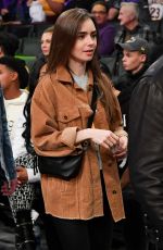 LILY COLLINS and Charlie McDowell at Cleveland Cavaliers vs LA Lakers Game in Los Angeles 01/13/2020
