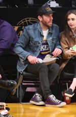 LILY COLLINS and Charlie McDowell at Cleveland Cavaliers vs LA Lakers Game in Los Angeles 01/13/2020