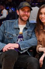 LILY COLLINS and Charlie McDowell at Cleveland Cavaliers vs LA Lakers Game in Los Angeles 01/13/2020