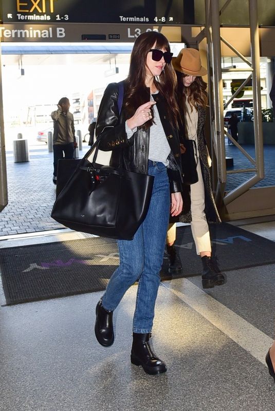 DAKOTA JOHNSON at LAX Airport in Los Angeles 02/14/2020