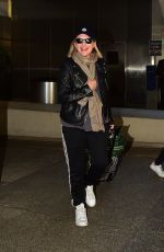 ELISABETH MOSS Arrives at LAX Airport in Los Angeles 02/23/2020