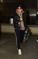 ELISABETH MOSS Arrives at LAX Airport in Los Angeles 02/23/2020
