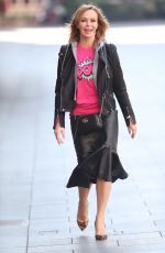 AMANDA HOLDEN in Leather Jacket and Skirt Out in London 03/27/2020