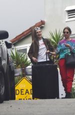 ASHLEY BENSON and CARA DELEVINGNE Out with Their Luggage in Los Angeles 03/16/2020