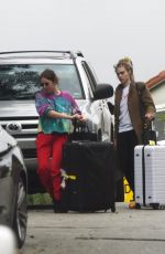 ASHLEY BENSON and CARA DELEVINGNE Out with Their Luggage in Los Angeles 03/16/2020