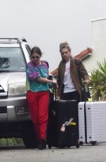 ASHLEY BENSON and CARA DELEVINGNE Out with Their Luggage in Los Angeles 03/16/2020