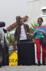 ASHLEY BENSON and CARA DELEVINGNE Out with Their Luggage in Los Angeles 03/16/2020