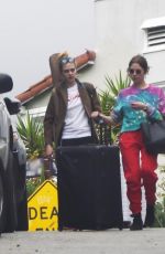 ASHLEY BENSON and CARA DELEVINGNE Out with Their Luggage in Los Angeles 03/16/2020