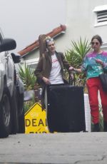 ASHLEY BENSON and CARA DELEVINGNE Out with Their Luggage in Los Angeles 03/16/2020