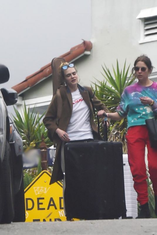 ASHLEY BENSON and CARA DELEVINGNE Out with Their Luggage in Los Angeles 03/16/2020