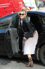 ASHLEY ROBERTS in Shimmering Skirt, Biker Jacket and Animal Printed Boots Out in London 03/17/2020