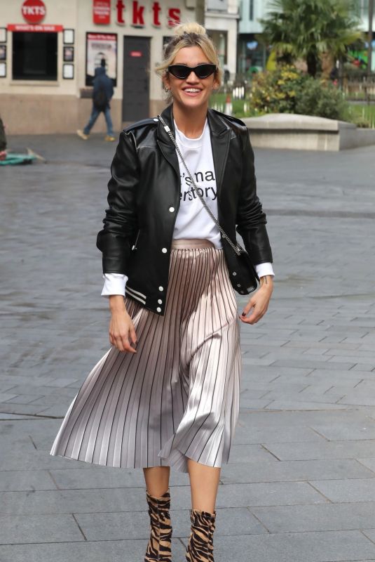 ASHLEY ROBERTS in Shimmering Skirt, Biker Jacket and Animal Printed Boots Out in London 03/17/2020
