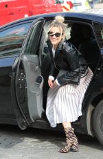 ASHLEY ROBERTS in Shimmering Skirt, Biker Jacket and Animal Printed Boots Out in London 03/17/2020