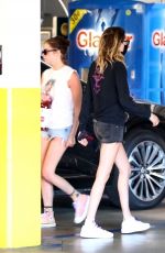 CARA DELEVINGNE and ASHLEY BENSON with Their Dog Out Shopping in Los Angeles 03/26/2020