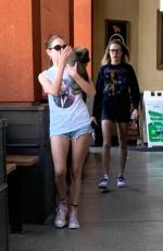 CARA DELEVINGNE and ASHLEY BENSON with Their Dog Out Shopping in Los Angeles 03/26/2020