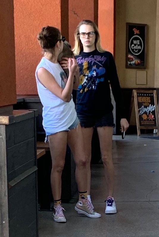 CARA DELEVINGNE and ASHLEY BENSON with Their Dog Out Shopping in Los Angeles 03/26/2020