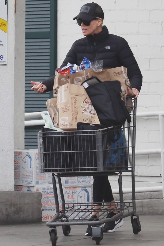 CHARLIZE THERON Stocks Up on Groceries in Beverly Hills 03/20/2020