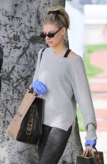 CHARLOTTE MCKINNEY Wears Gloves while Shopping at Erewhon in Santa Monica 03/17/2020