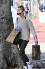 CHARLOTTE MCKINNEY Wears Gloves while Shopping at Erewhon in Santa Monica 03/17/2020