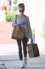 CHARLOTTE MCKINNEY Wears Gloves while Shopping at Erewhon in Santa Monica 03/17/2020
