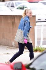 DAKOTA FANNING Wear Pink Latex Gloves Out in Los Angeles 03/16/2020