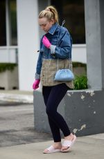 DAKOTA FANNING Wear Pink Latex Gloves Out in Los Angeles 03/16/2020