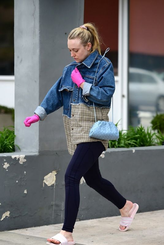 DAKOTA FANNING Wear Pink Latex Gloves Out in Los Angeles 03/16/2020