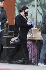 DEMI LOVATO with Black Face Mask and Disposable Gloves Shopping at Erewhon in Los Angeles 03/15/2020