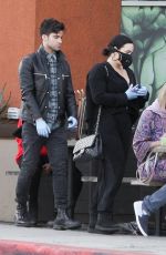 DEMI LOVATO with Black Face Mask and Disposable Gloves Shopping at Erewhon in Los Angeles 03/15/2020