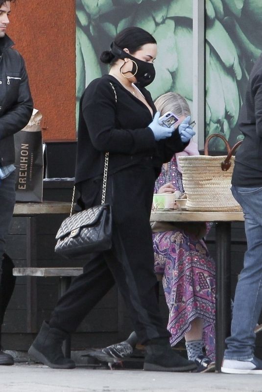 DEMI LOVATO with Black Face Mask and Disposable Gloves Shopping at Erewhon in Los Angeles 03/15/2020