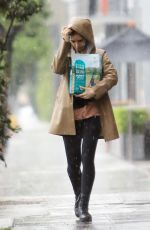 LILY COLLINS Out in the Rain to Pick Up Dog Food in Los Angeles 03/13/2020