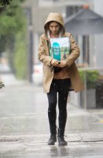 LILY COLLINS Out in the Rain to Pick Up Dog Food in Los Angeles 03/13/2020