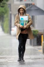 LILY COLLINS Out in the Rain to Pick Up Dog Food in Los Angeles 03/13/2020