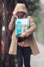 LILY COLLINS Out in the Rain to Pick Up Dog Food in Los Angeles 03/13/2020