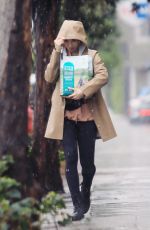 LILY COLLINS Out in the Rain to Pick Up Dog Food in Los Angeles 03/13/2020