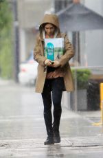 LILY COLLINS Out in the Rain to Pick Up Dog Food in Los Angeles 03/13/2020