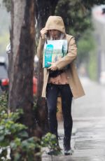 LILY COLLINS Out in the Rain to Pick Up Dog Food in Los Angeles 03/13/2020