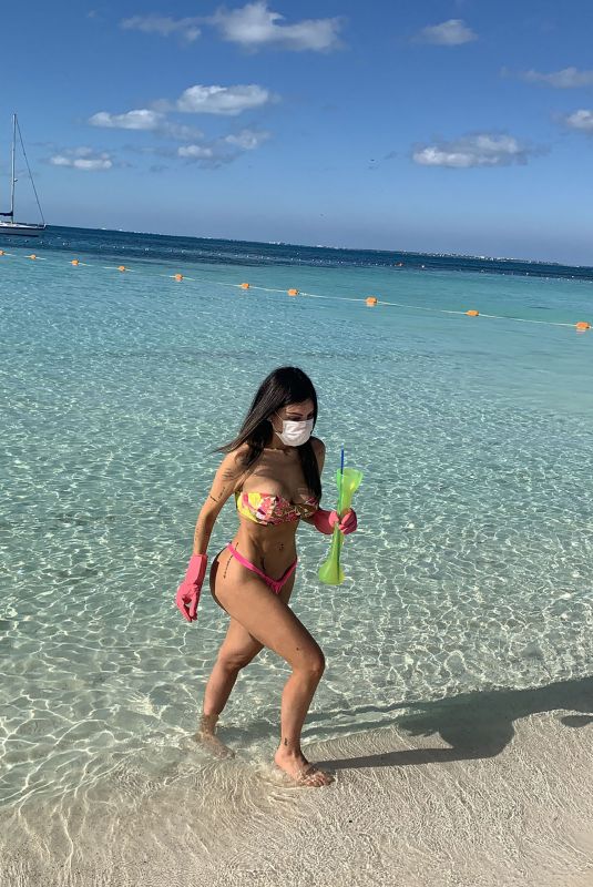 LIZIANE GUTIERREZ in Bikini Wears Mask and Rubber Gloves at a Beach in Mexico 03/28/2020