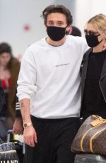 NICOLA PELTZ and Brooklyn Beckham Wear Matching Masks at JFK Airport in New York 03/09/2020