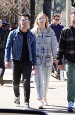 Pregnant SOPHIE TURNER in a Washed Out Denim Jumpsuit Out wioth Joe Jonas in Los Angeles 03/03/2020