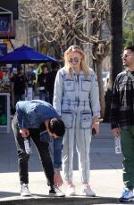 Pregnant SOPHIE TURNER in a Washed Out Denim Jumpsuit Out wioth Joe Jonas in Los Angeles 03/03/2020