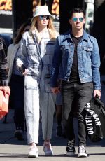 Pregnant SOPHIE TURNER in a Washed Out Denim Jumpsuit Out wioth Joe Jonas in Los Angeles 03/03/2020